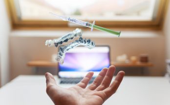 open palm with syringe floating above